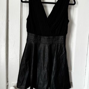 Black Sleeveless V-Neck Mini Dress. Pleather skirt with deep v top